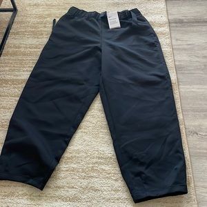 Nike womens black tech pack pants, size medium